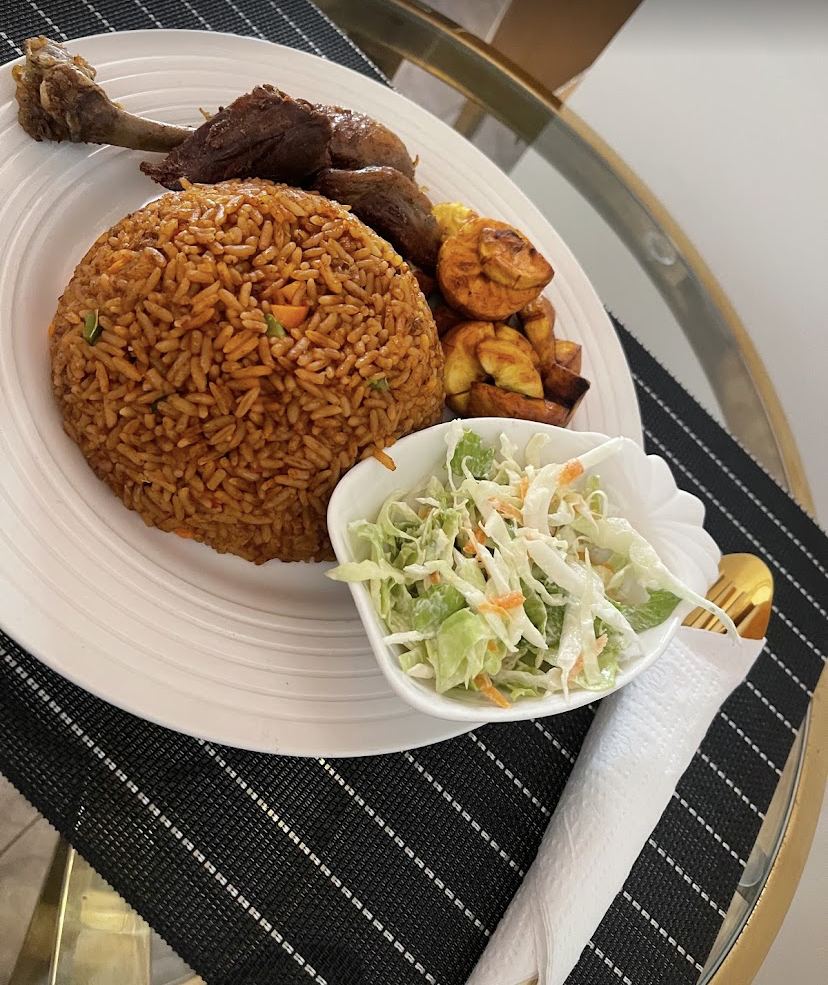 Many Nations GH: jollof rice with chicken, fried plantain and coleslaw at BOOMiiS Accra