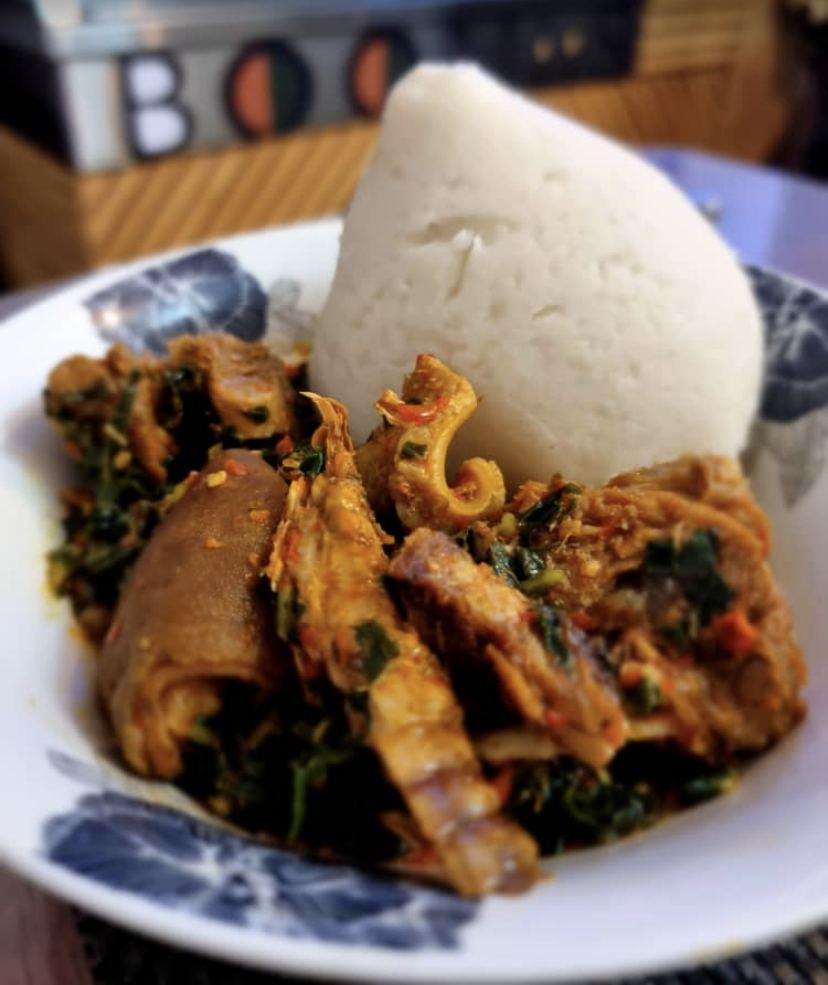 Pounded yam with efo riro vegetable soup and assorted meats